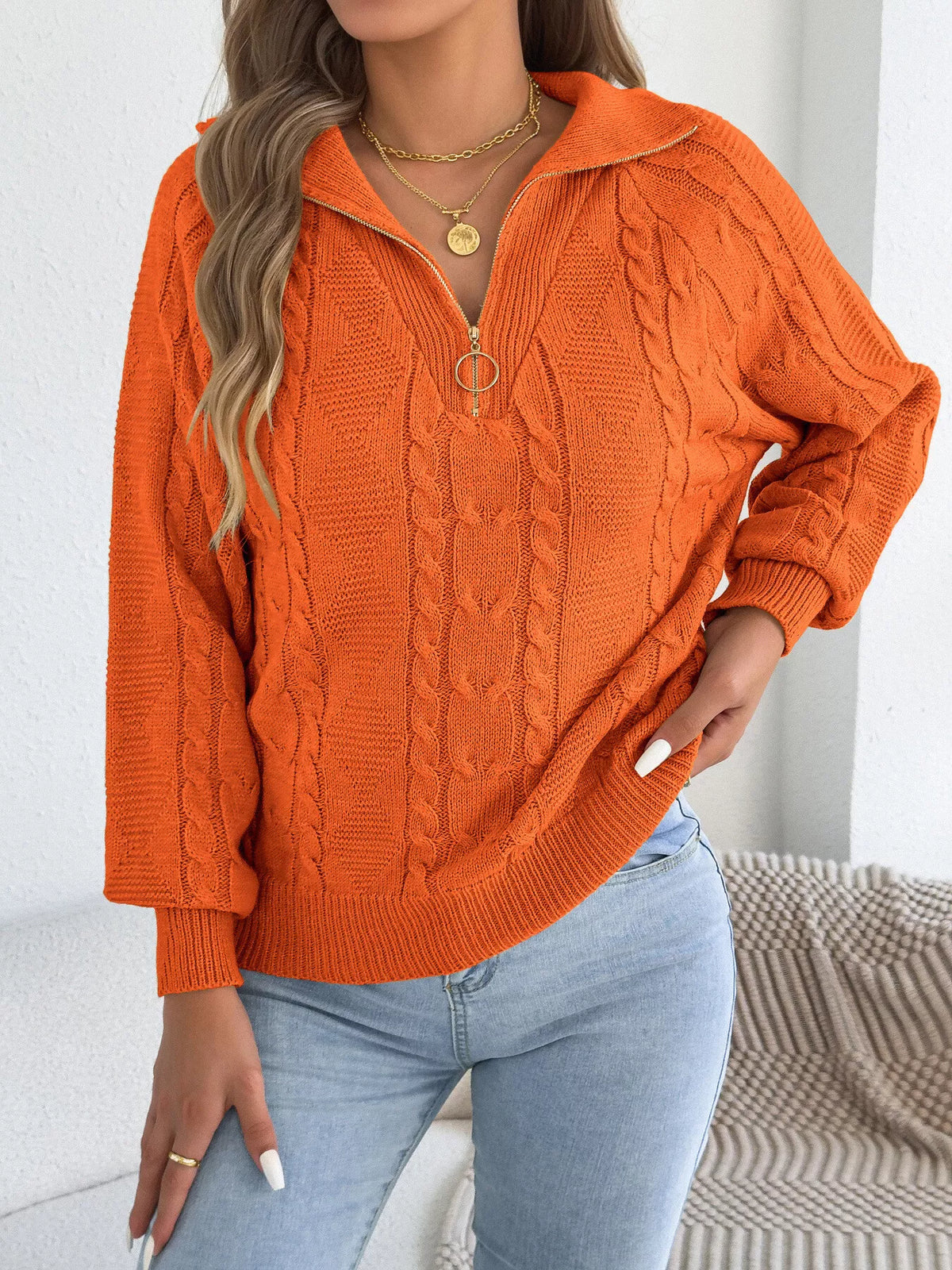 Orange quarter-zip cable knit sweater