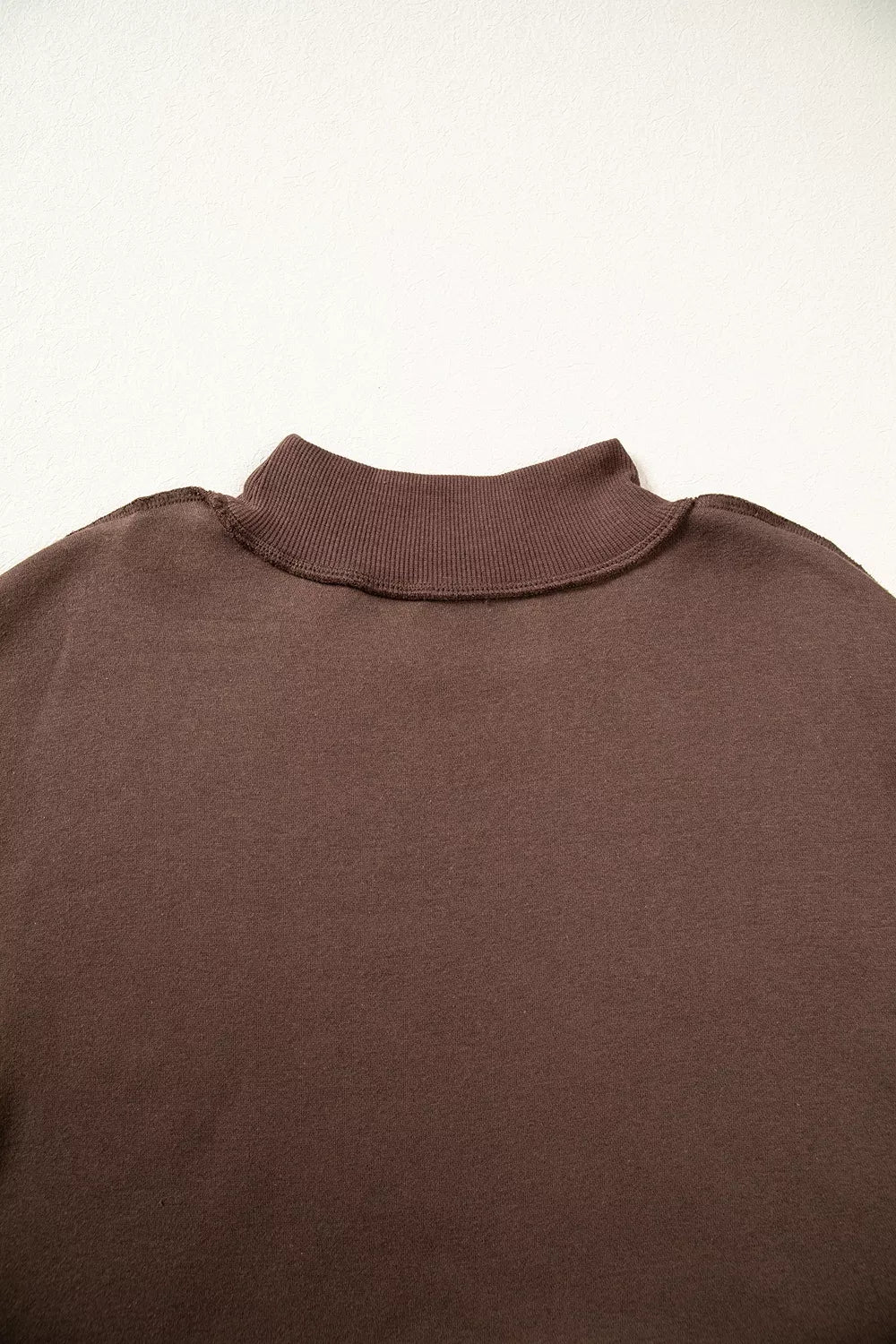 Brown wwjd patchwork graphic mock-neck sweatshirt, back neckline detail.