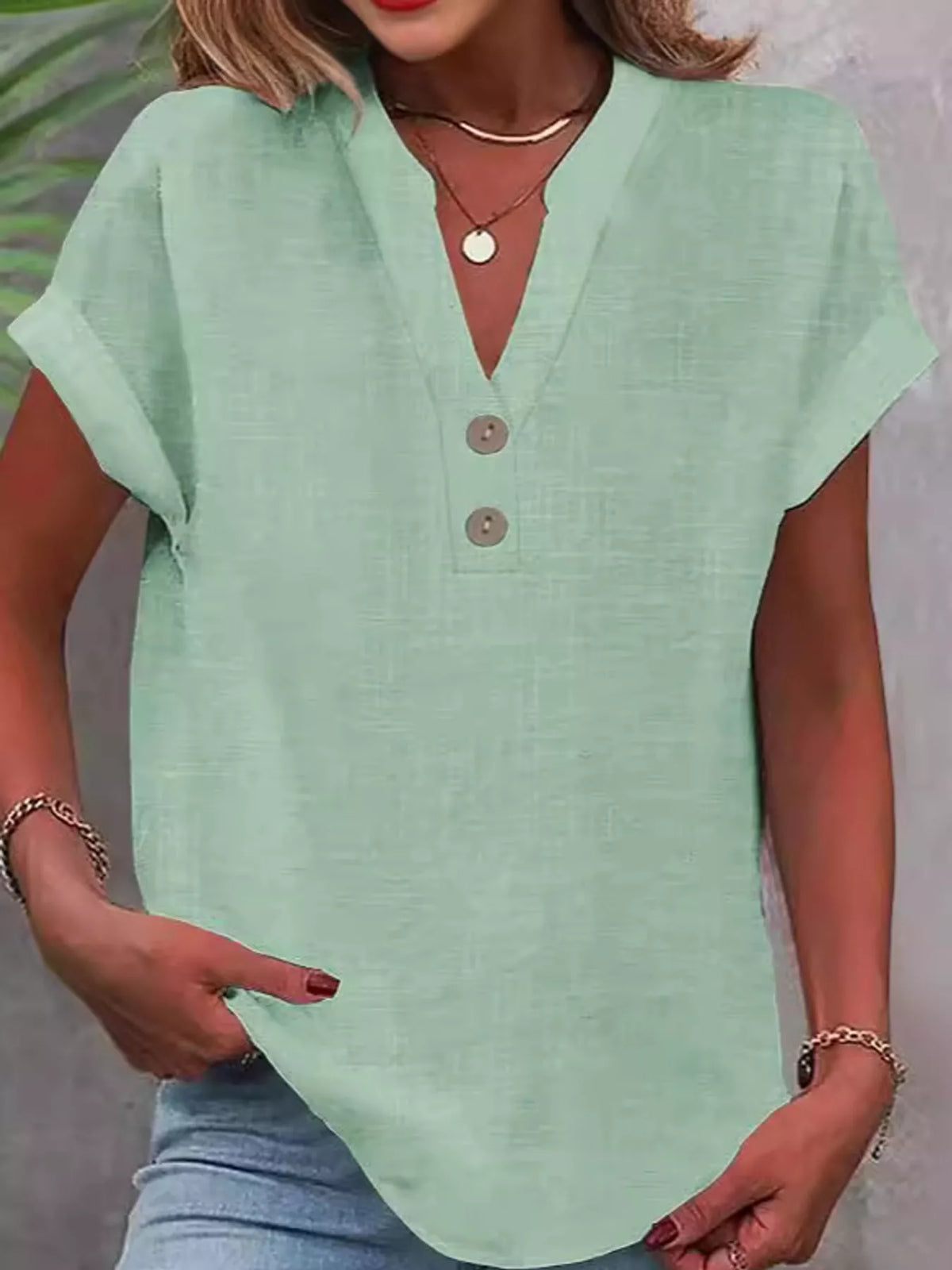 Green button detail short sleeve blouse, front view