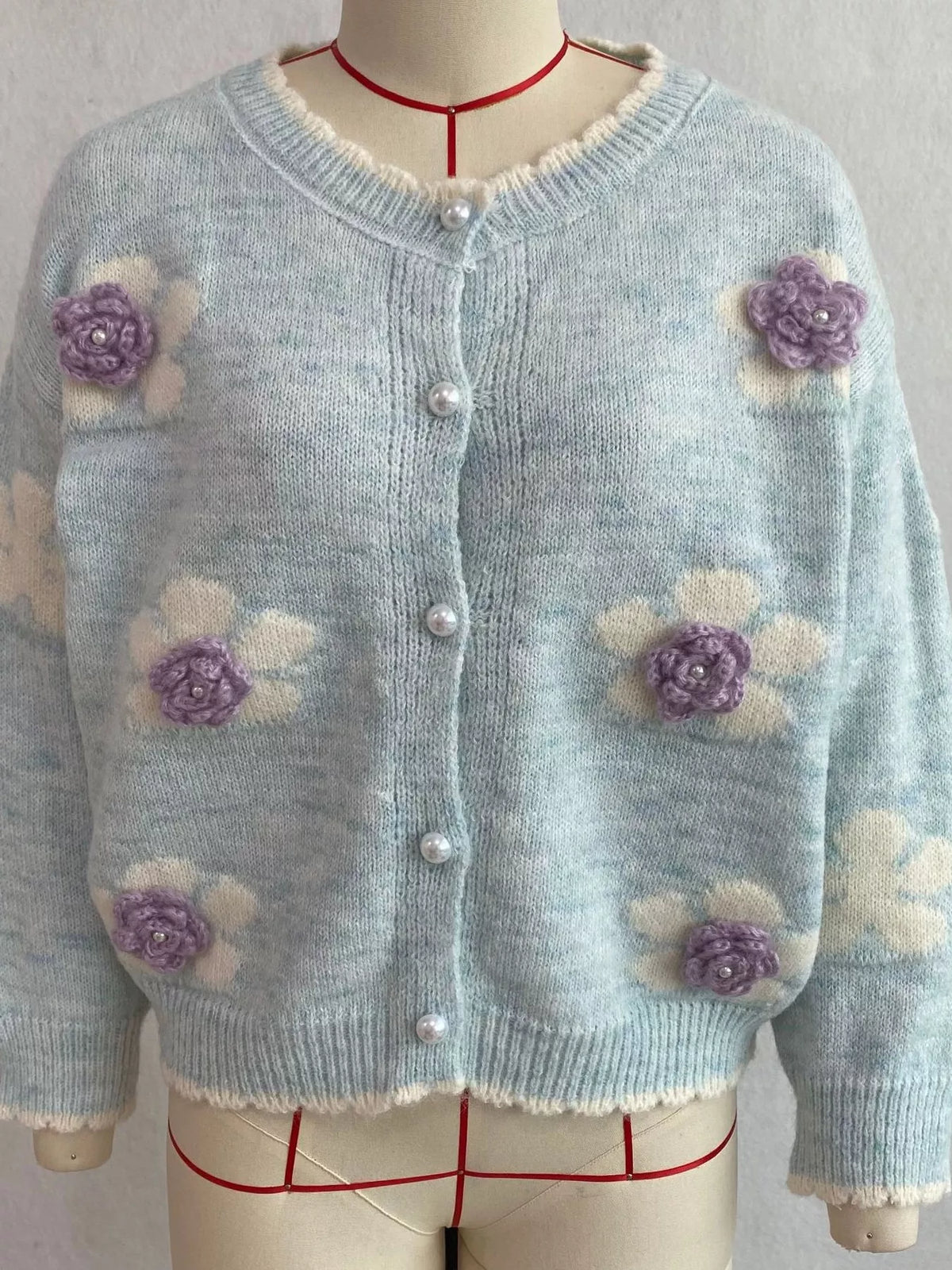 Floral-applique knit cardigan in light blue, mannequin front view