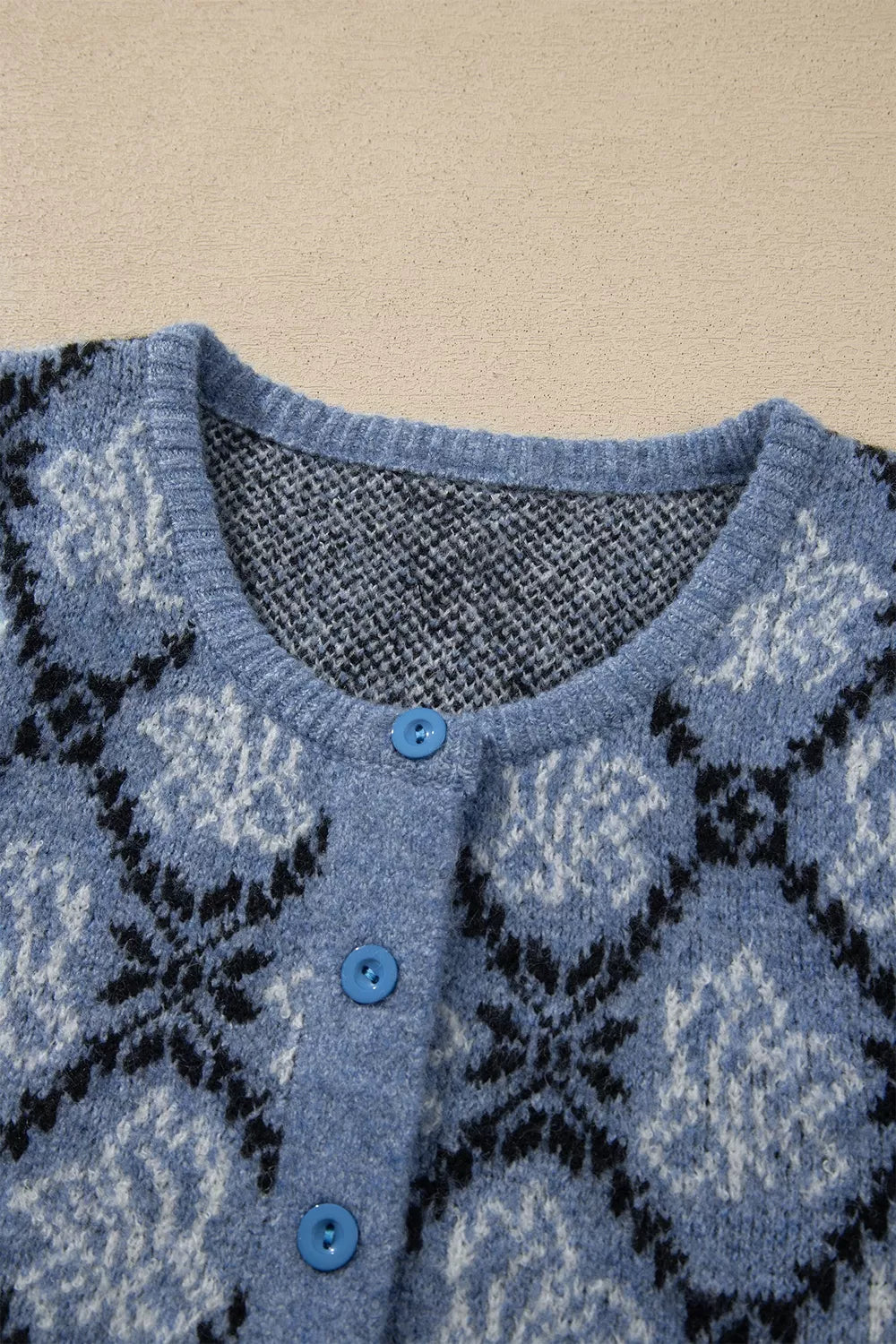 Blue geometric short sleeve cardigan, neckline and buttons