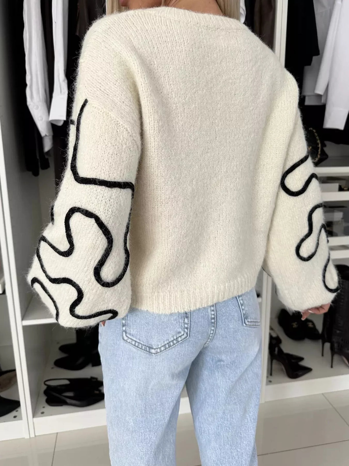 Ivory abstract pattern oversized crewneck sweater, back view.