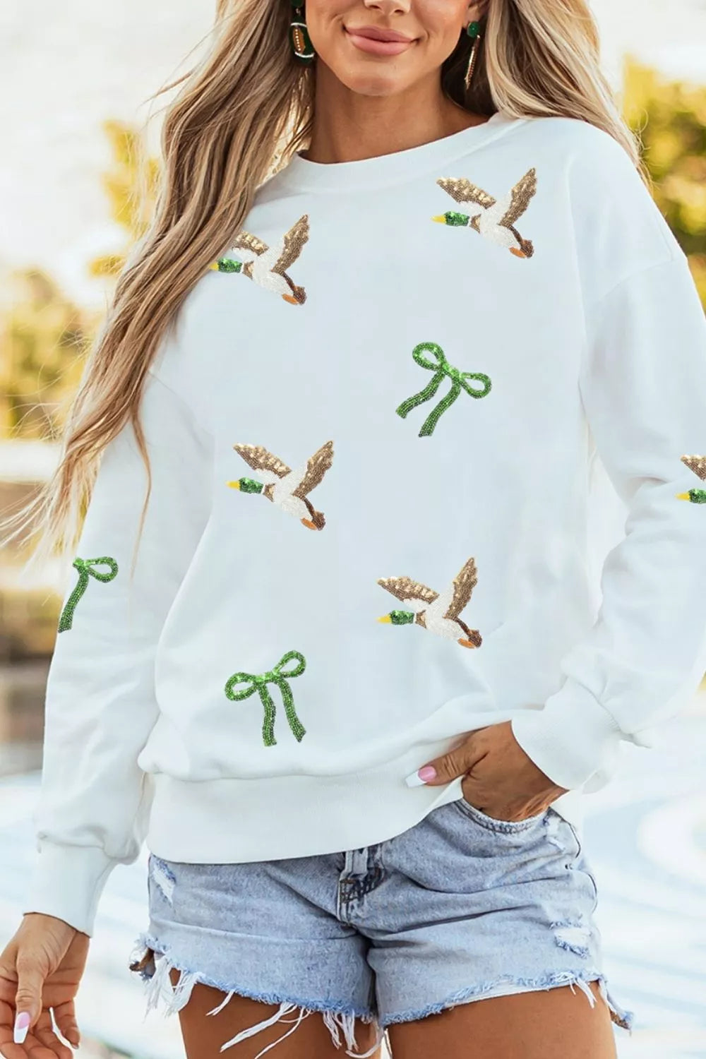 White mallard and bow sequin sweatshirt, front view