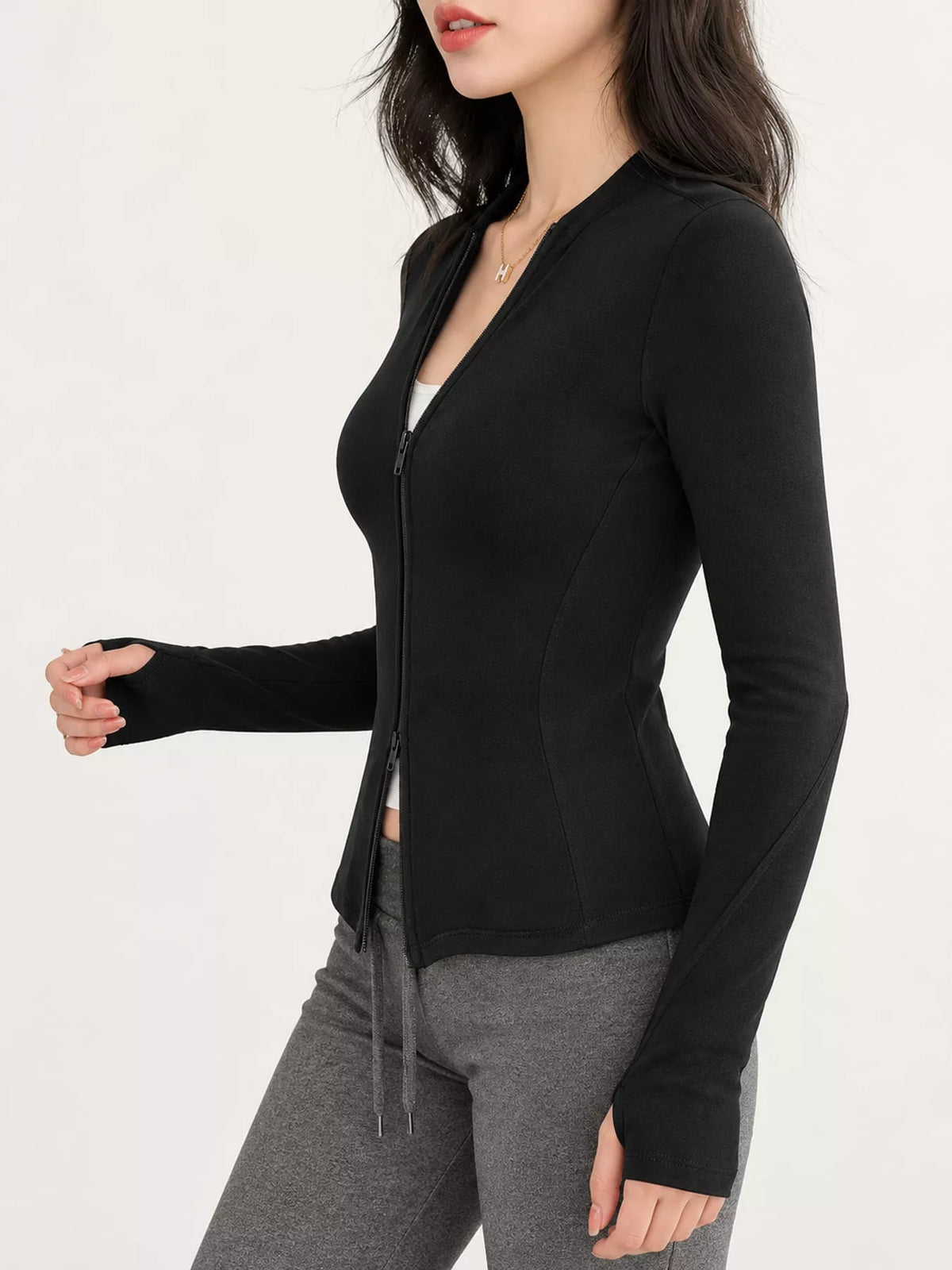 Black slim-fit zip-up long sleeve jacket — side view