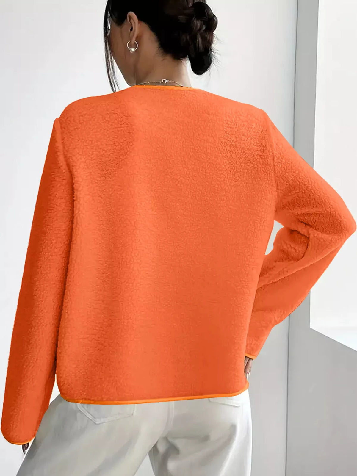 Orange textured button-front jacket — back view