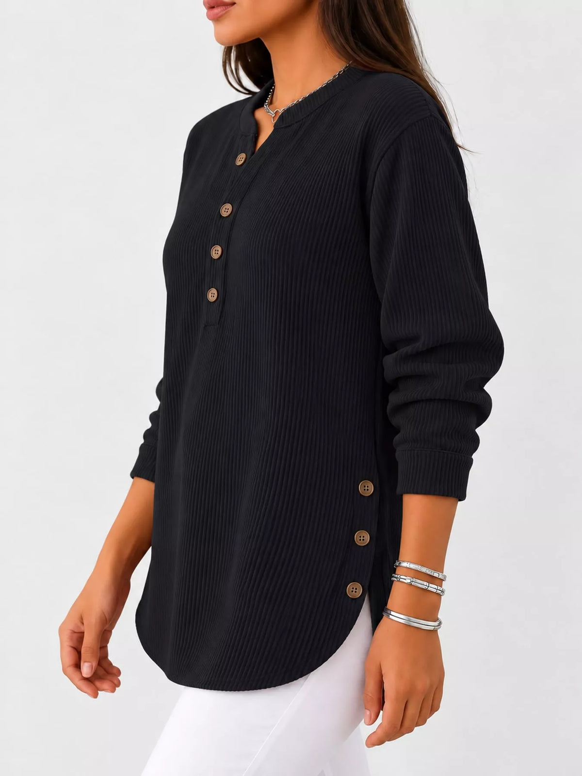 Black button detail long sleeve top, side view
