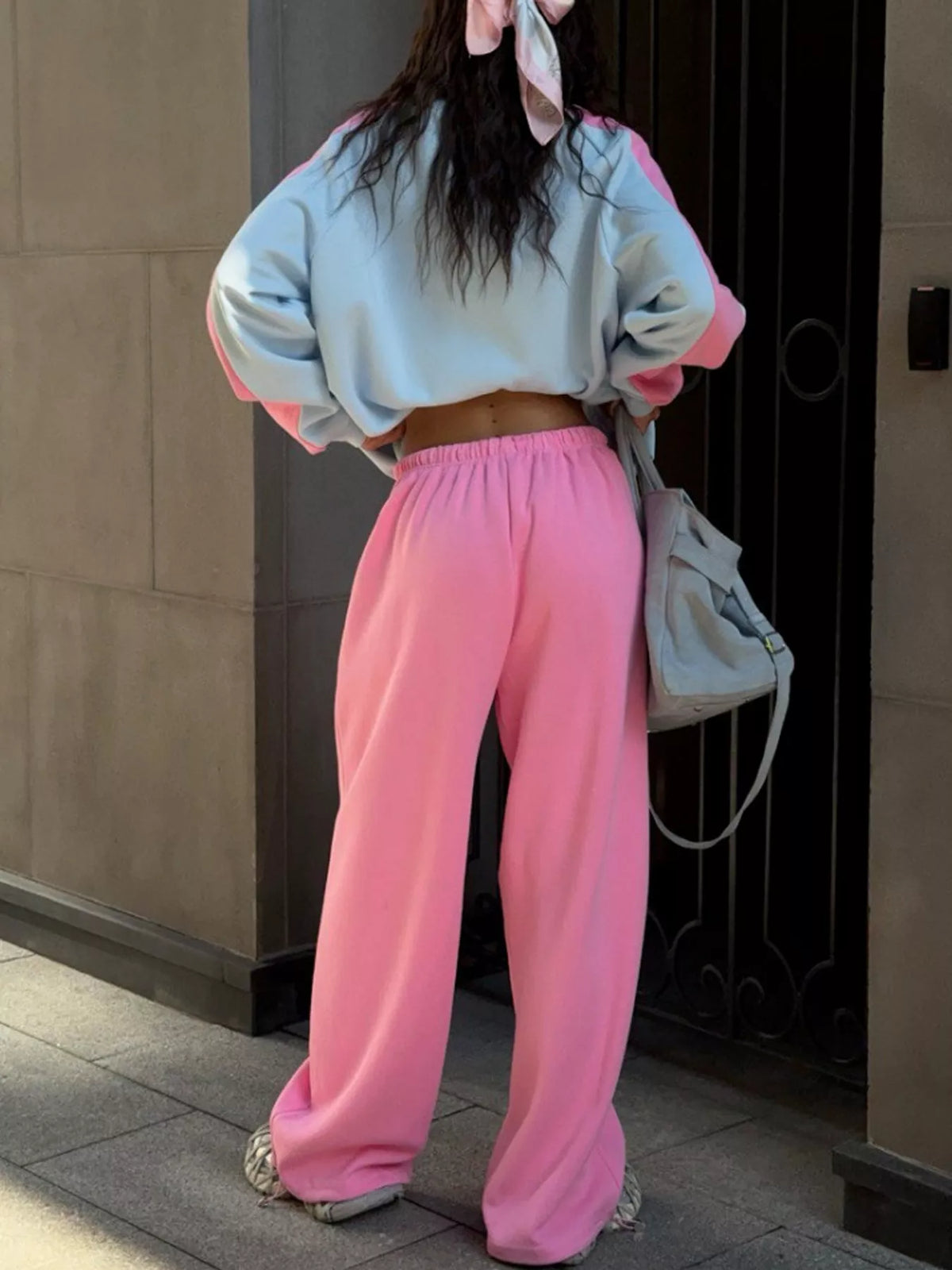 Blue top and pink pants color-block sweatshirt and wide-leg pants set — back view
