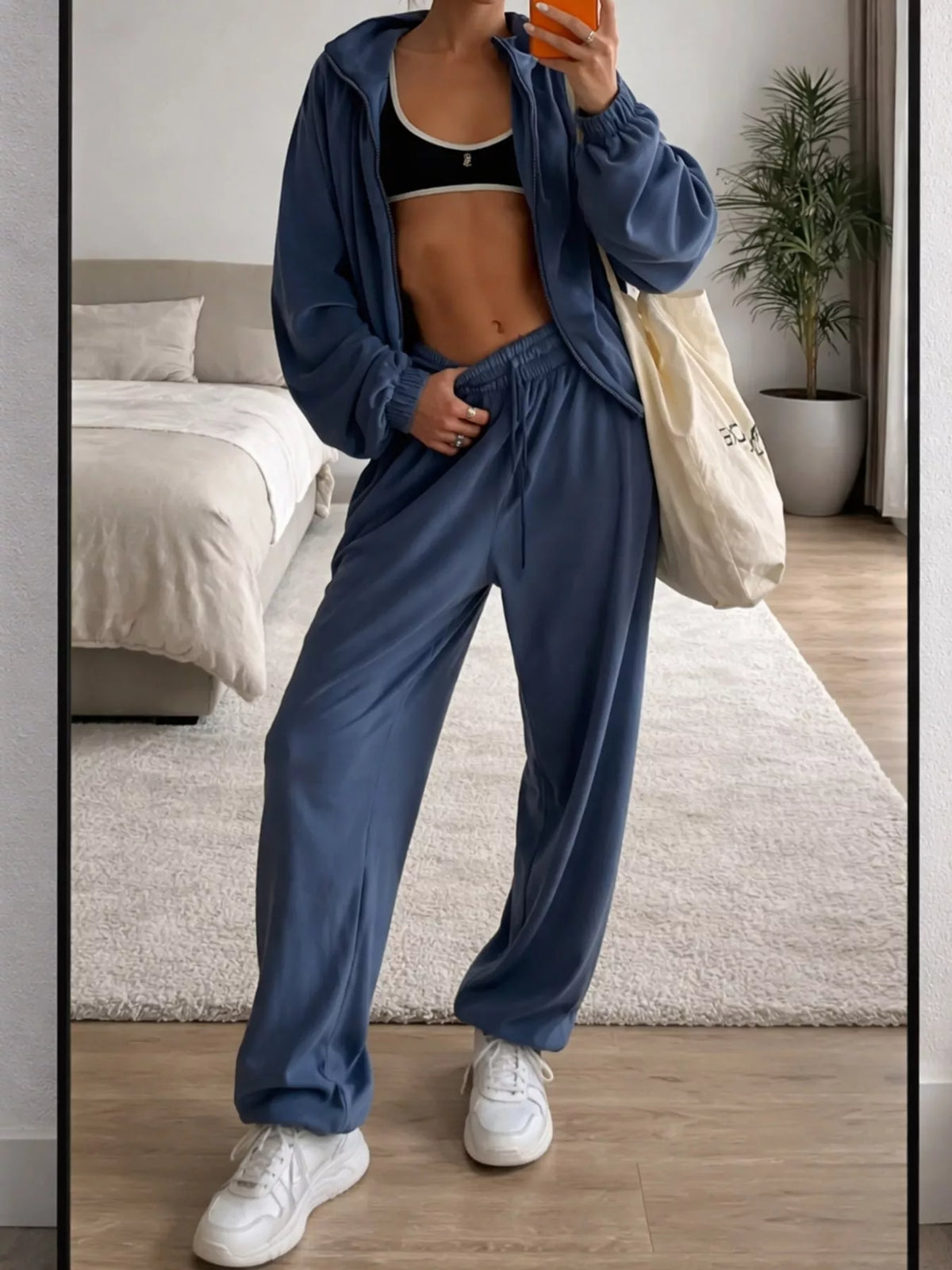 Blue zip-up outerwear and pants set — front view