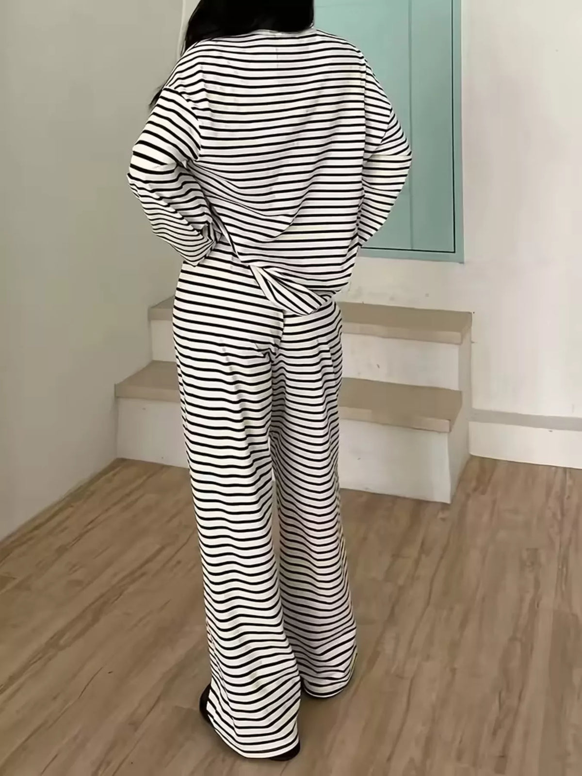 Black striped long-sleeve top and pants set, back view