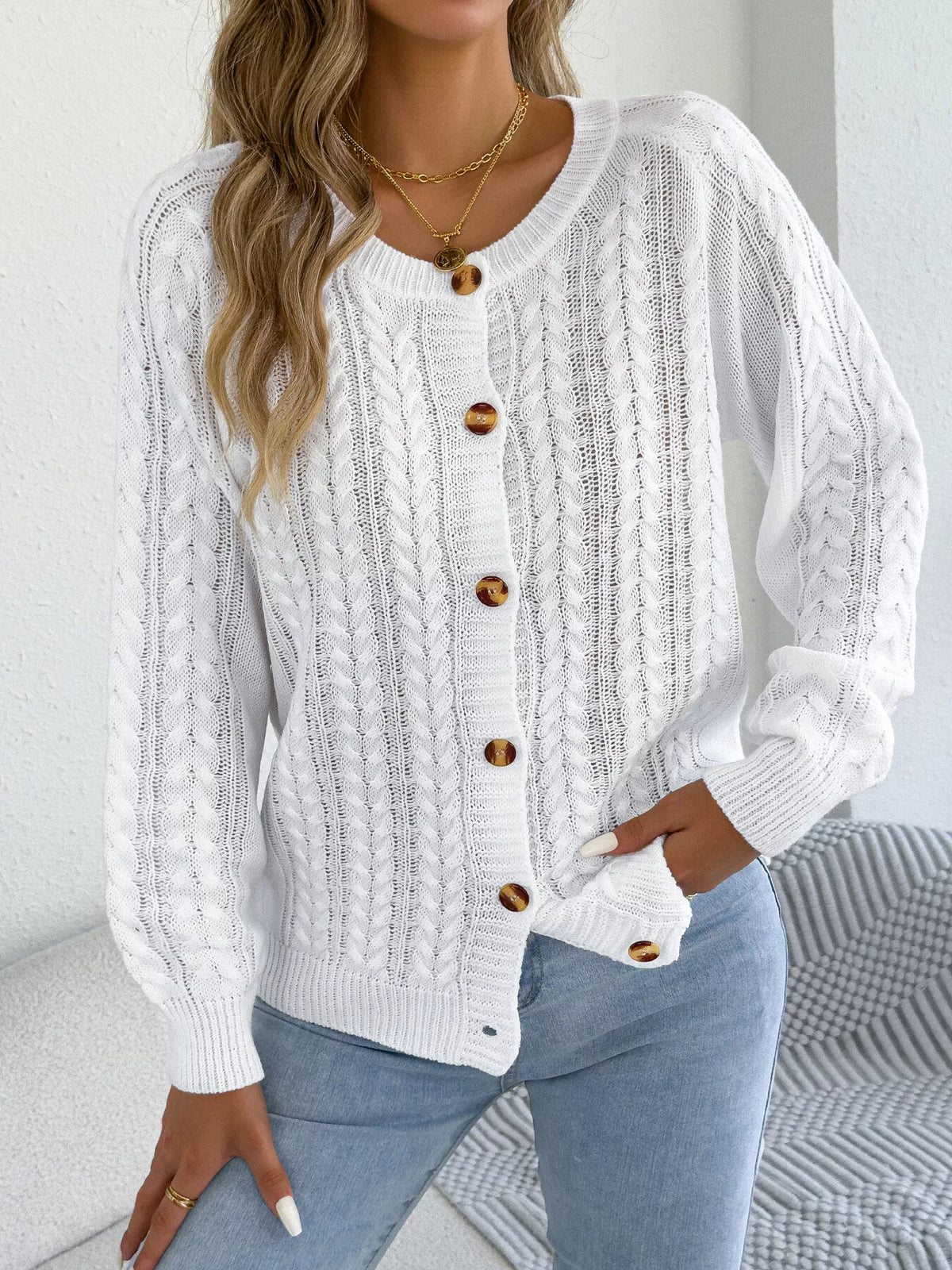 White cable knit button-front cardigan