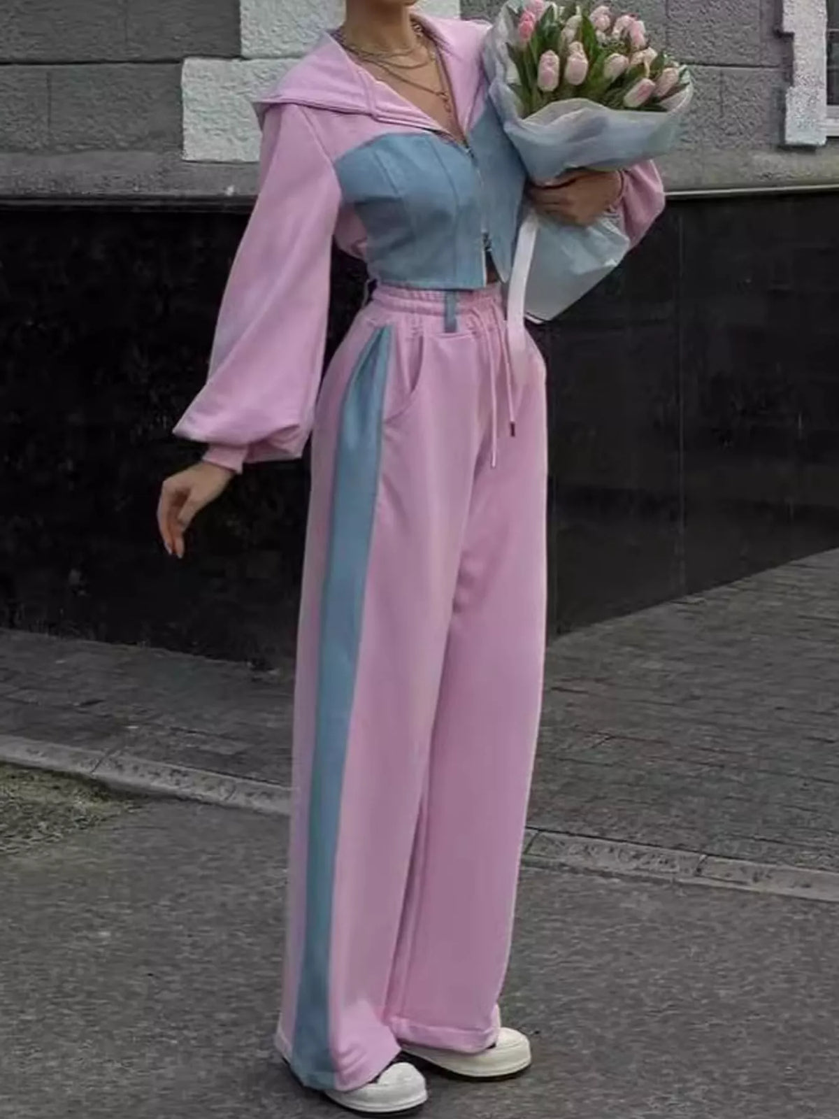 Pink and blue color-block zip-up hoodie and wide-leg pants set — front view