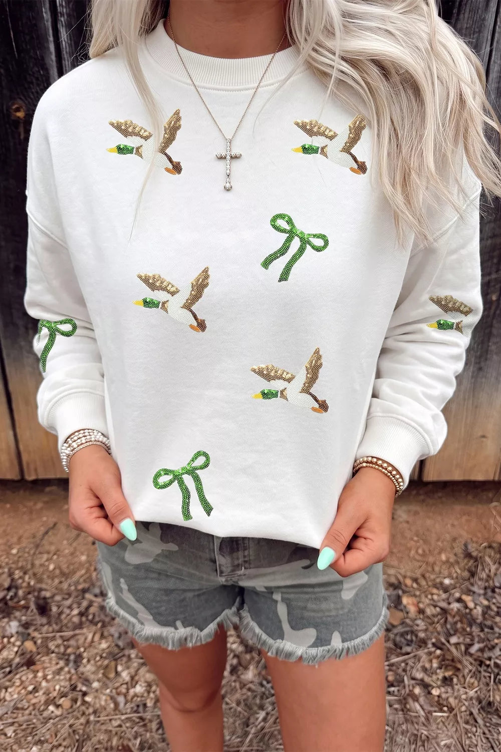 White mallard and bow sequin sweatshirt, front view