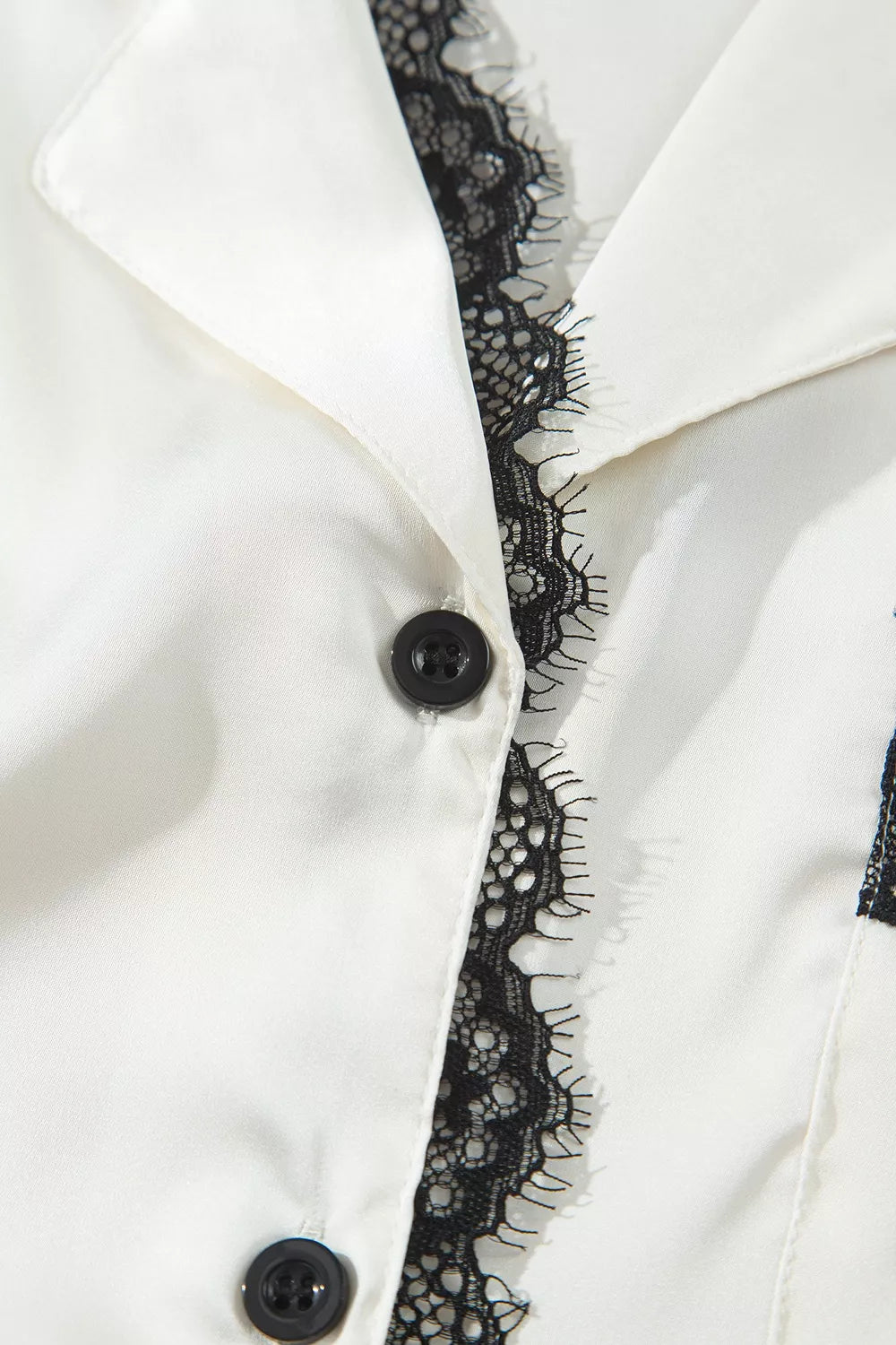 Ivory lace-trim button-front pajama set, button placket detail.