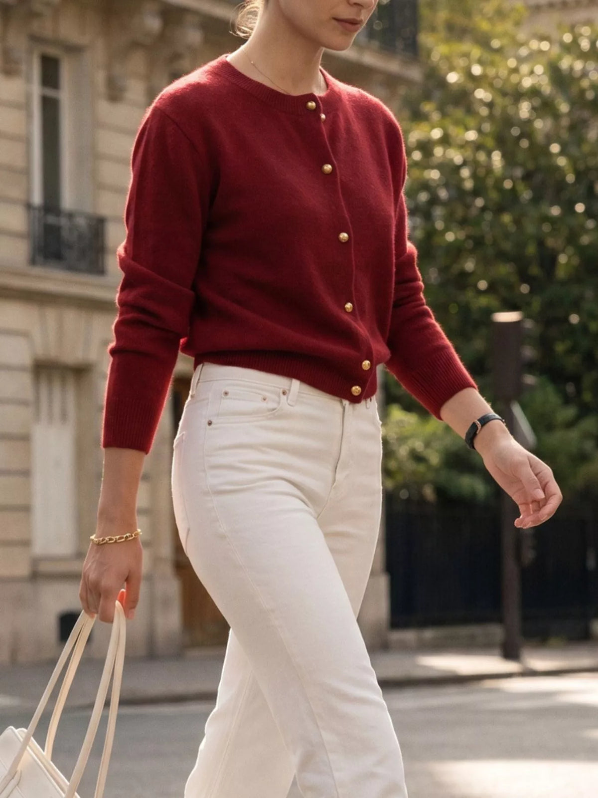 Burgundy round-neck button-front knit cardigan, walking front view.