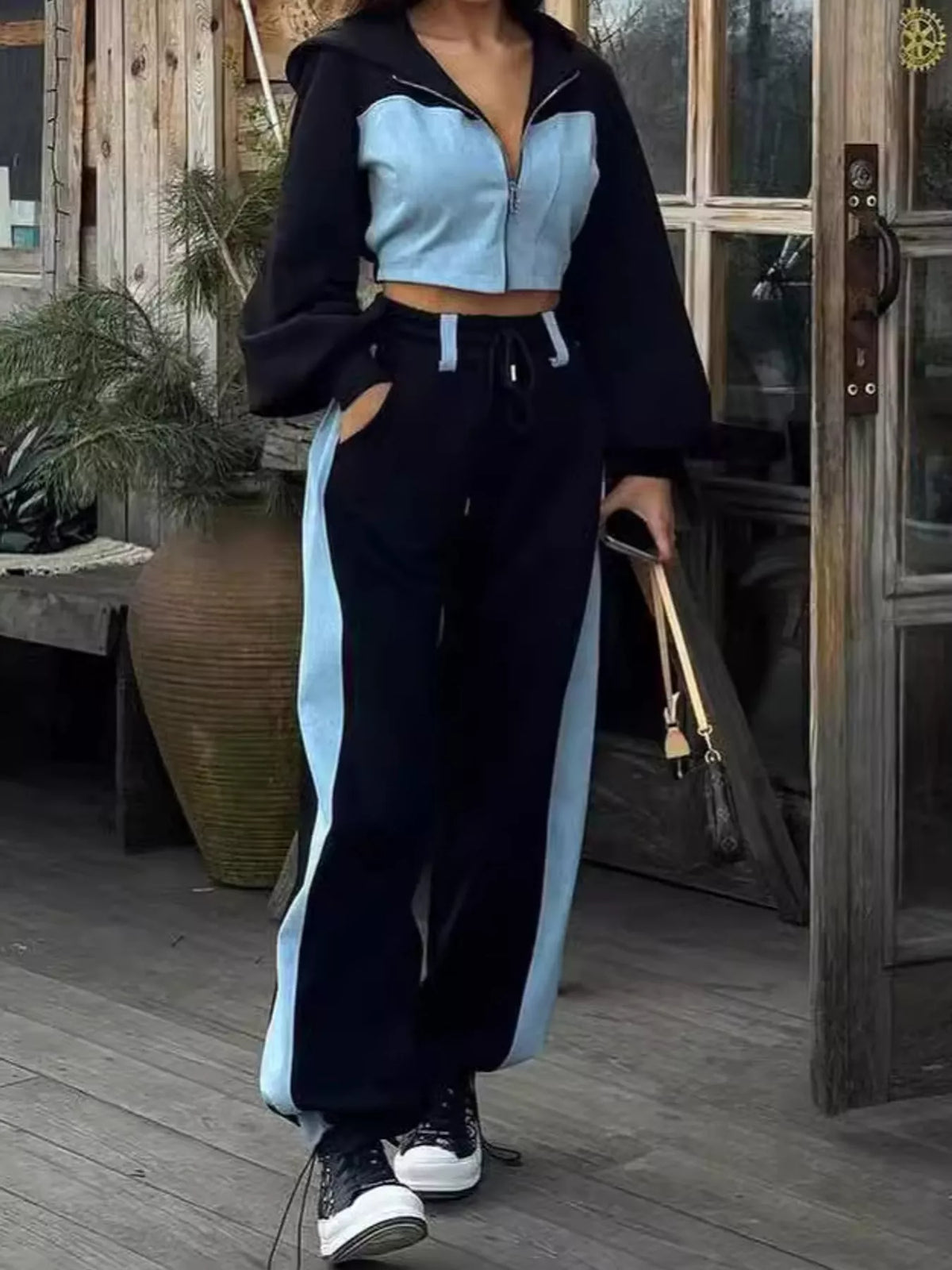 Navy and light blue color-block zip-up hoodie and wide-leg pants set — front view