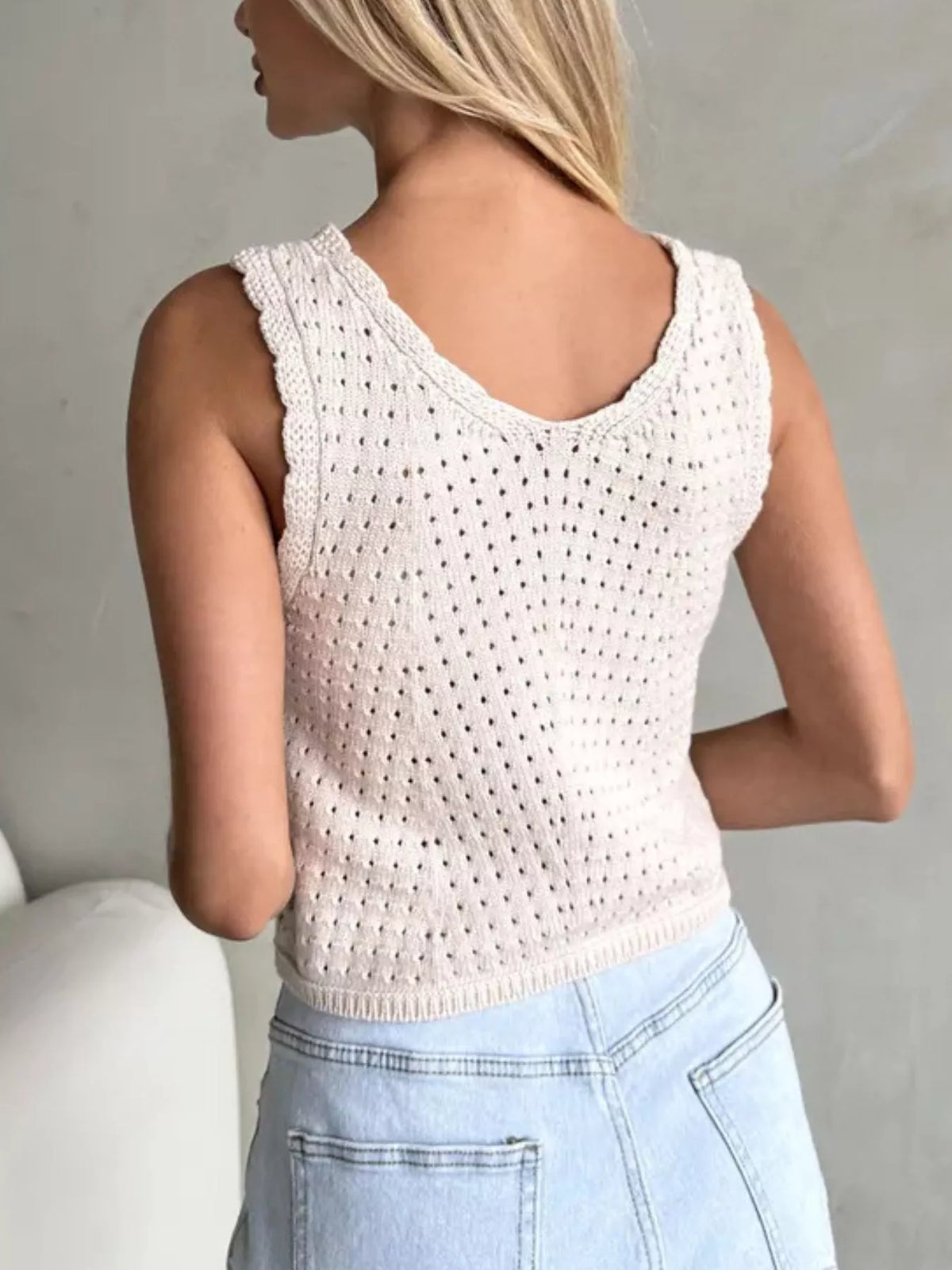 Ivory openwork button-detail knit tank top, back view.