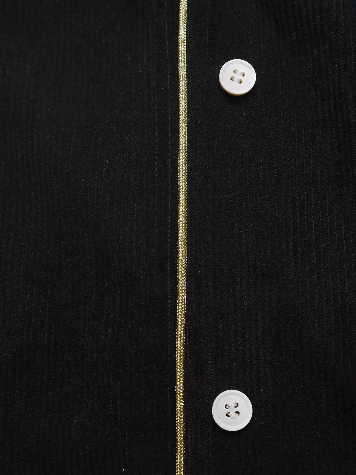Black corduroy button-front midi skirt, button placket detail