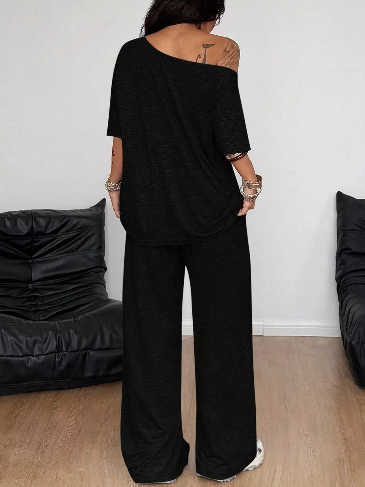 Black boat neck top and wide-leg pants set — back view