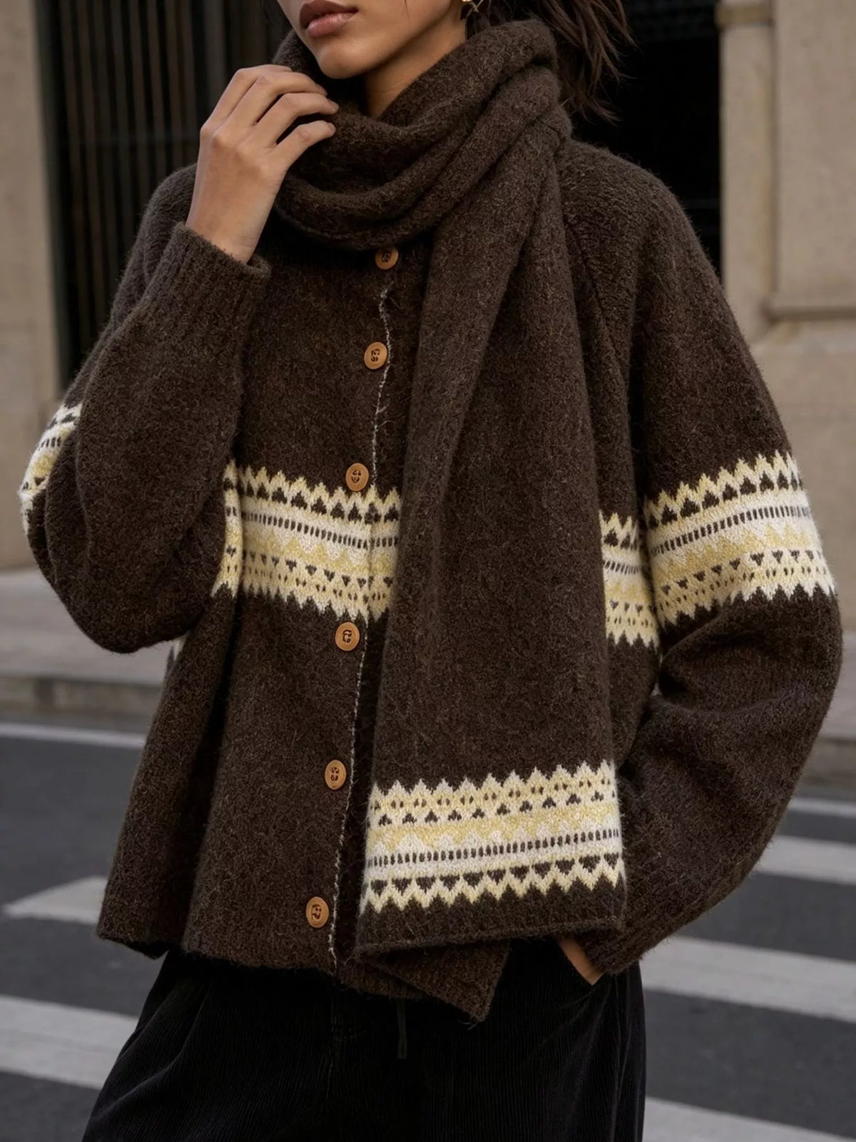 Brown geometric button-front knit cardigan, front detail with scarf.
