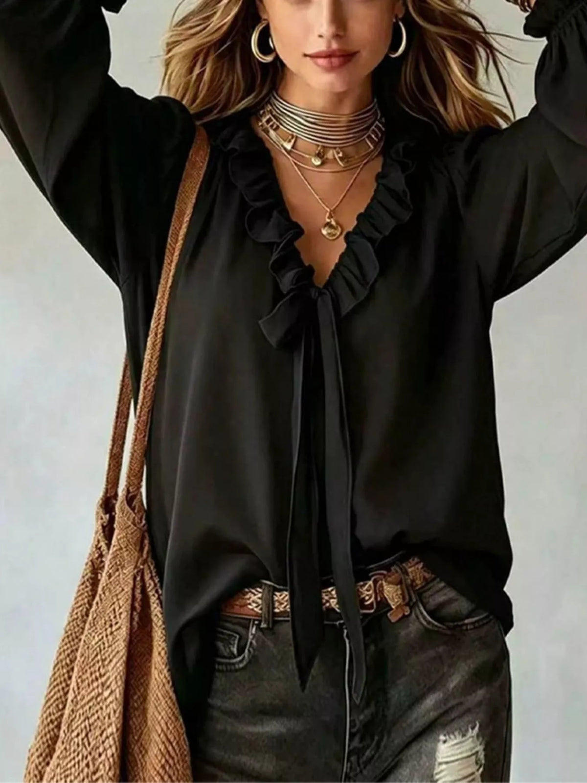 Black ruffled v-neck blouse with tie-front detail