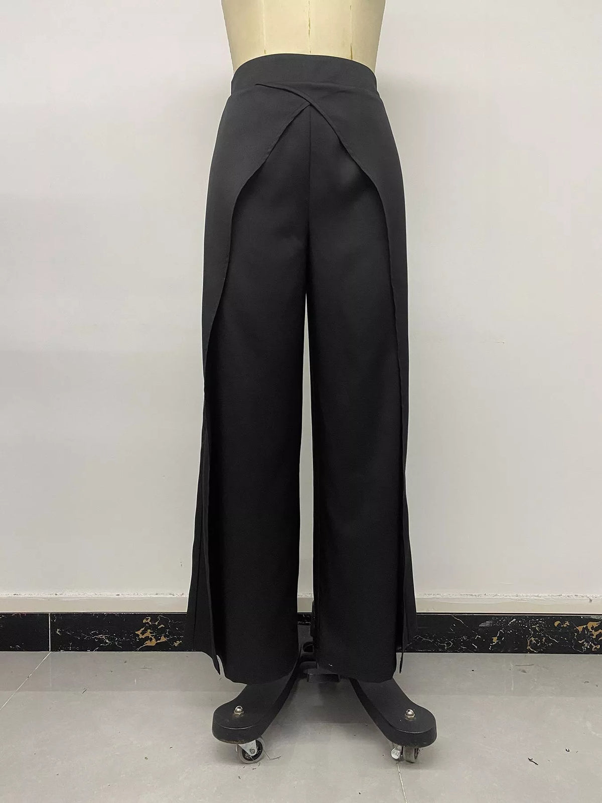 Black wide-leg pants with overlap front, front on mannequin