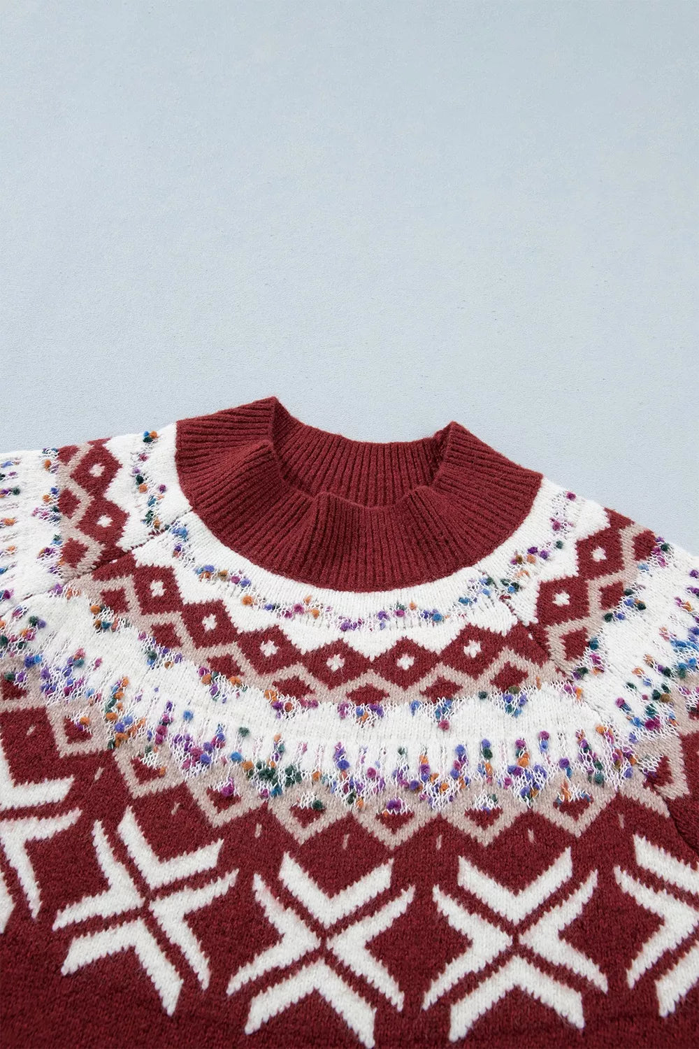 Burgundy Christmas geometric sweater, front neckline detail