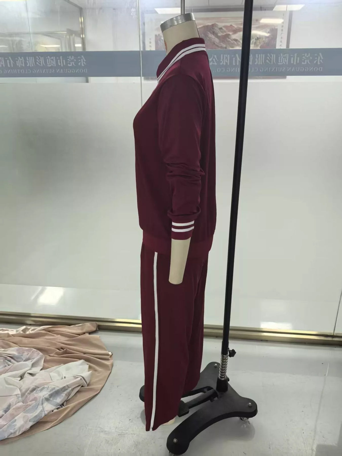 Burgundy striped half zip top and pants set, side view