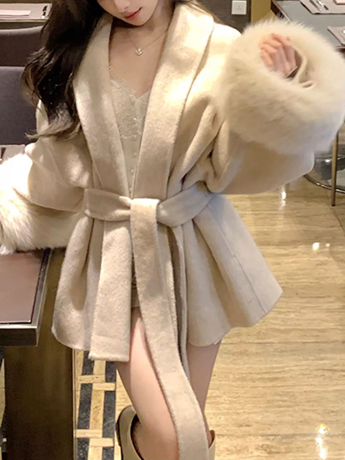 Cream tie-waist coat with faux fur cuffs — front view