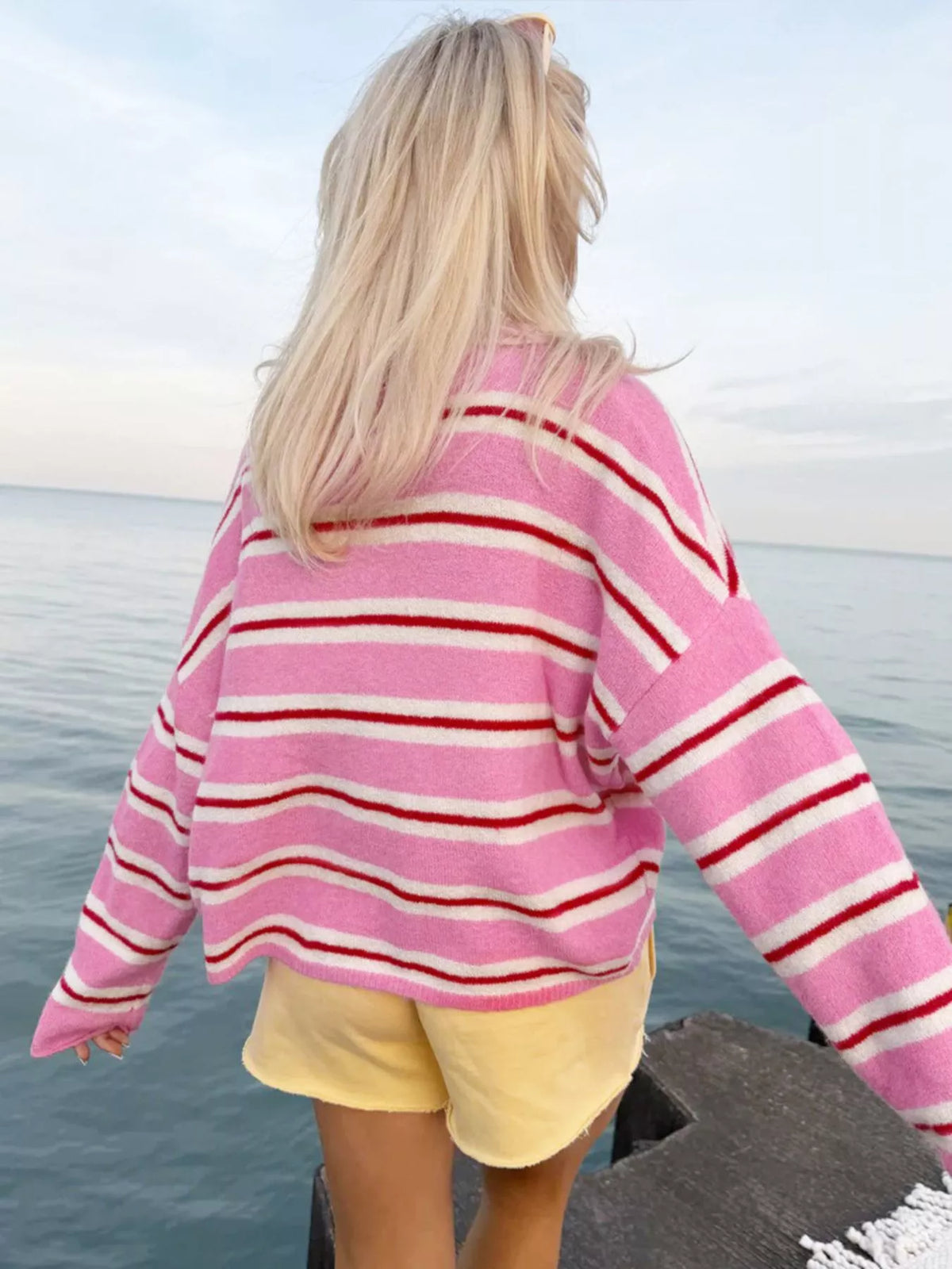Pink striped button-front cardigan, back view
