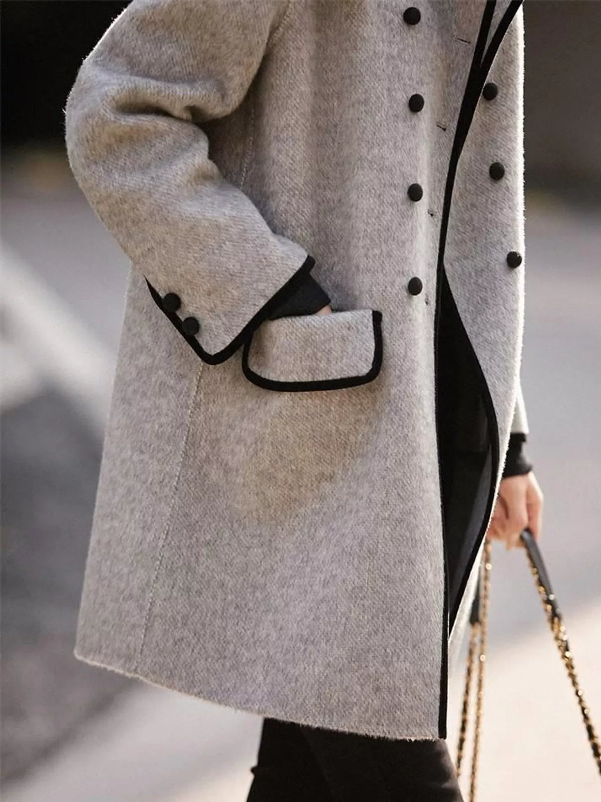 Gray double breasted coat with contrast trim, side view