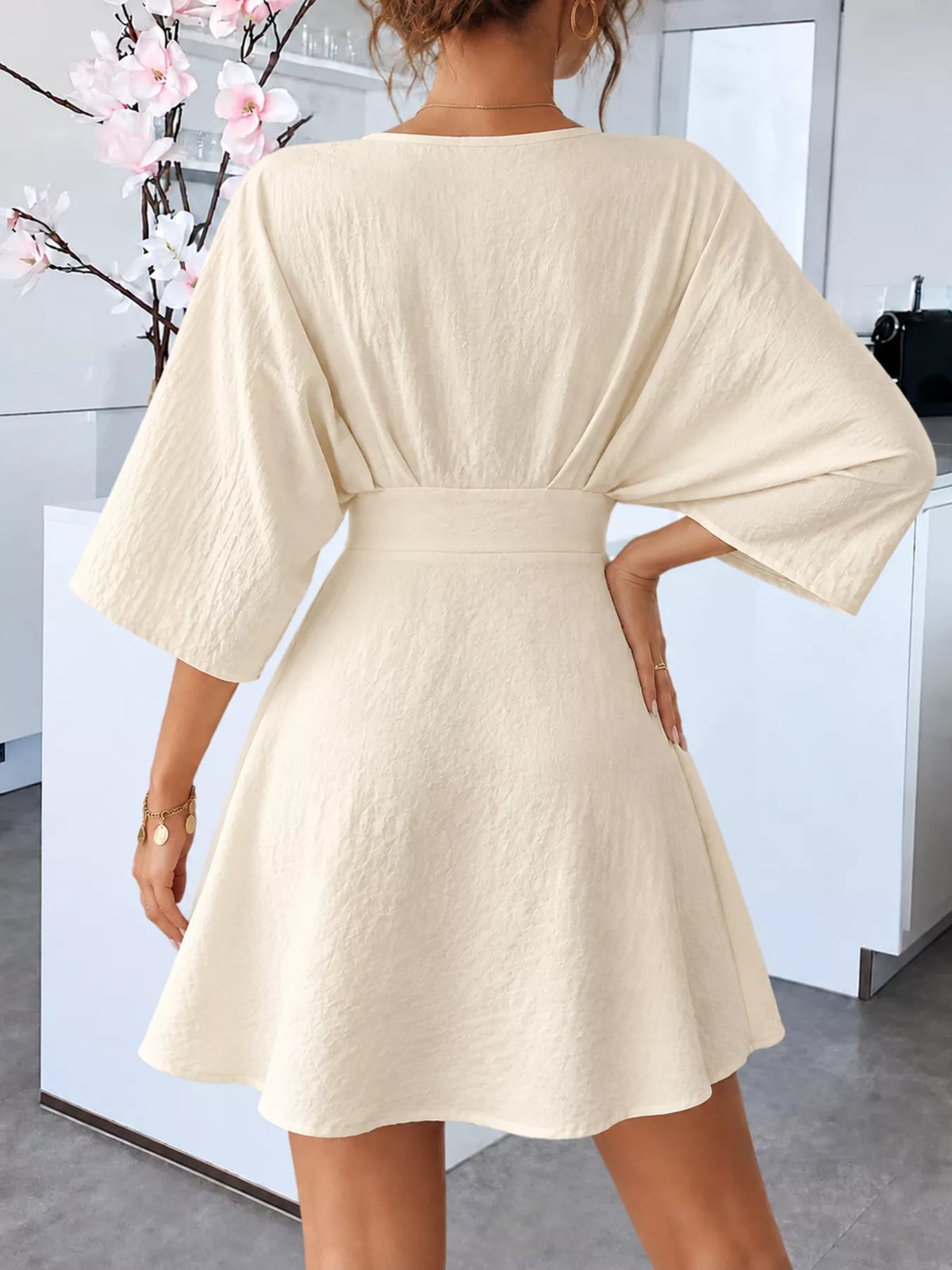V-Neck Textured Mini Dress, back view in beige