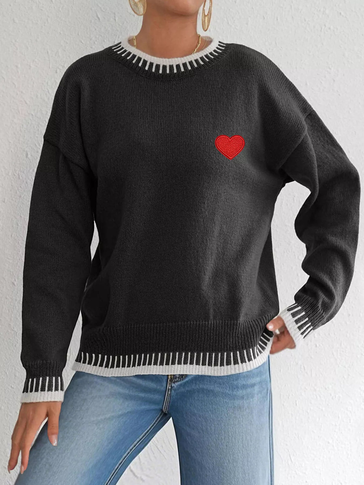 Heart-embroidered contrast-trim sweater in black, full front view