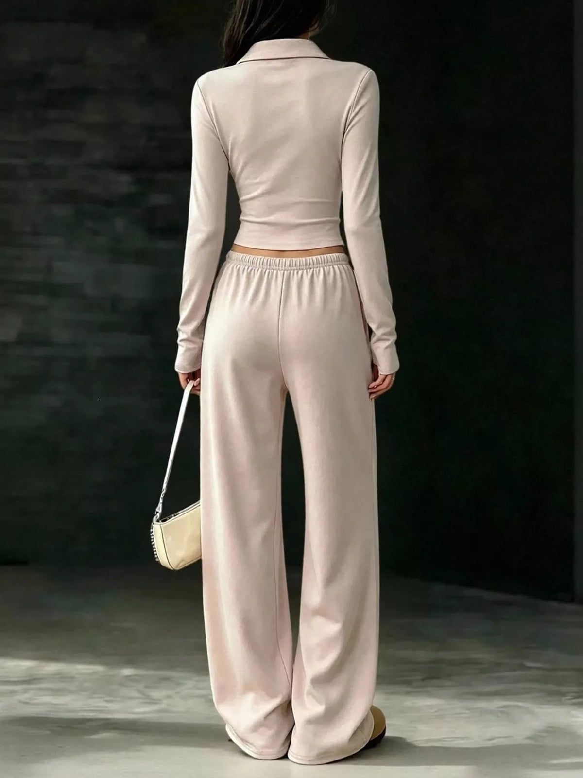 Beige collared crop top and wide-leg pants set, back view