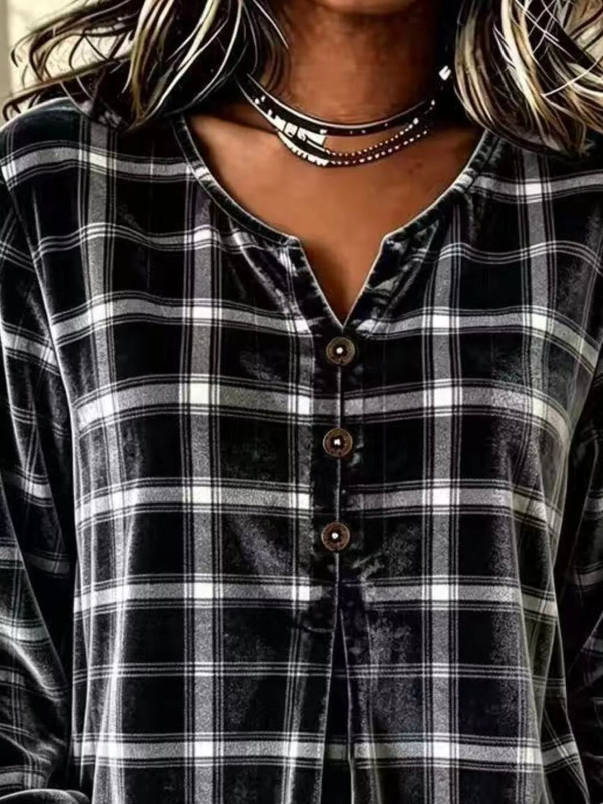 Black plaid velvet balloon-sleeve blouse, neckline and buttons close-up