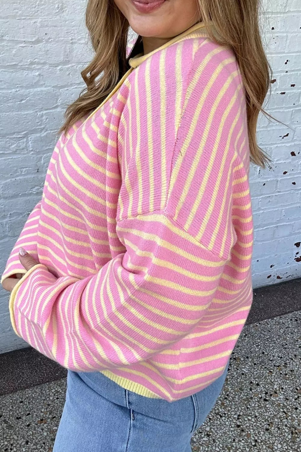 Pink and yellow striped button-detail sweater, side and sleeve view