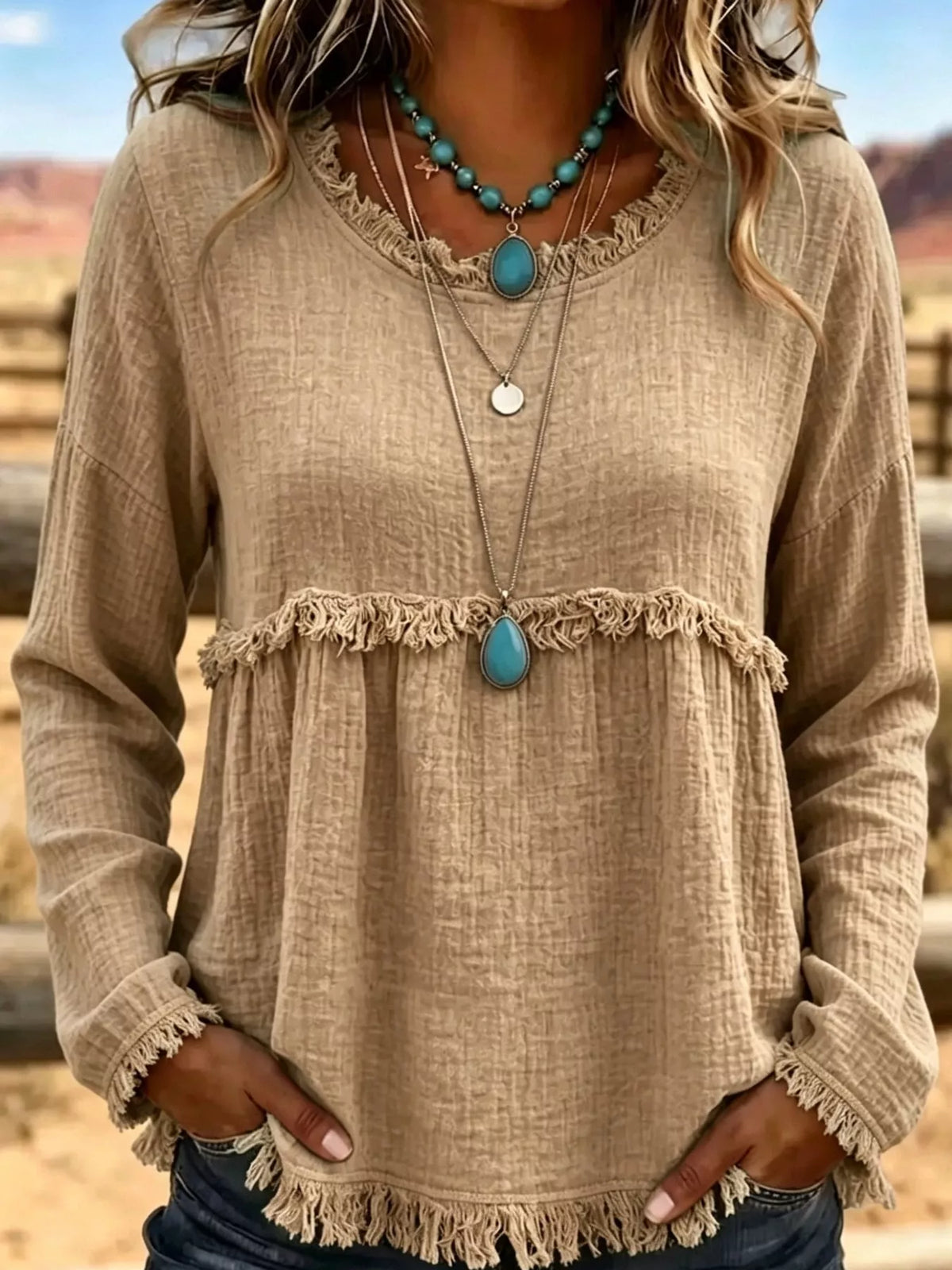Beige frayed hem textured blouse, front view