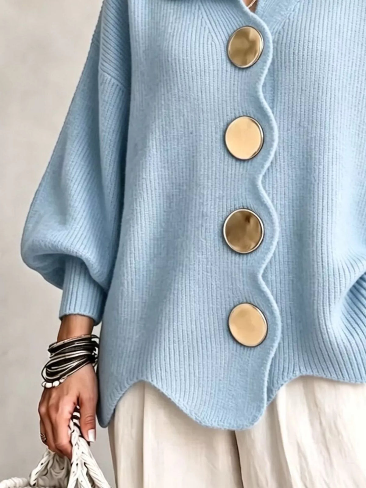 Light blue scalloped-edge knit cardigan, button and cuff detail