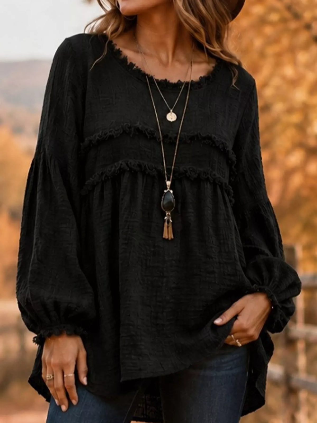 Black textured frayed-trim peplum blouse