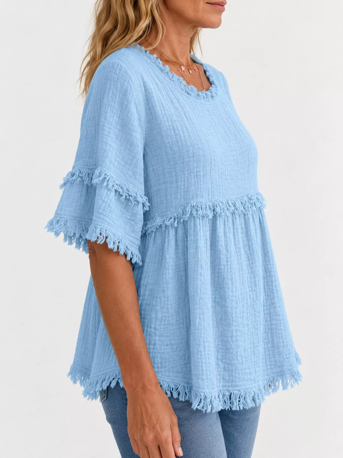 Blue frayed edge textured blouse, side view