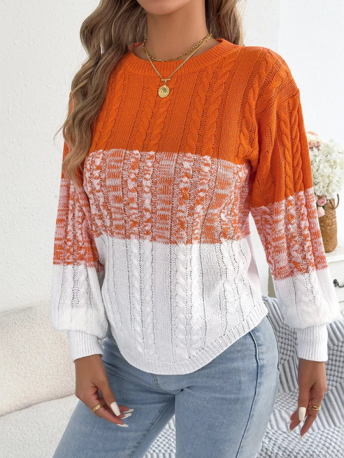 Orange color block cable knit sweater