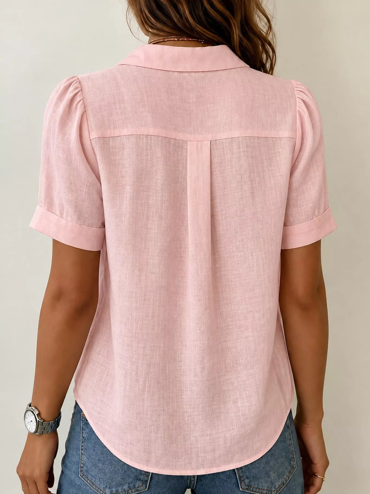 Pink button up short sleeve shirt, back view