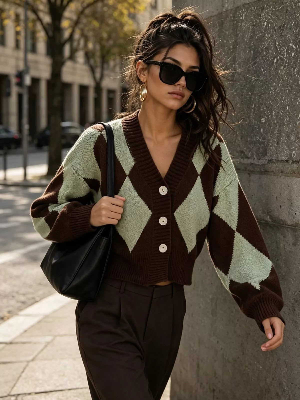 Brown and green argyle v-neck button-front cardigan, walking front view.