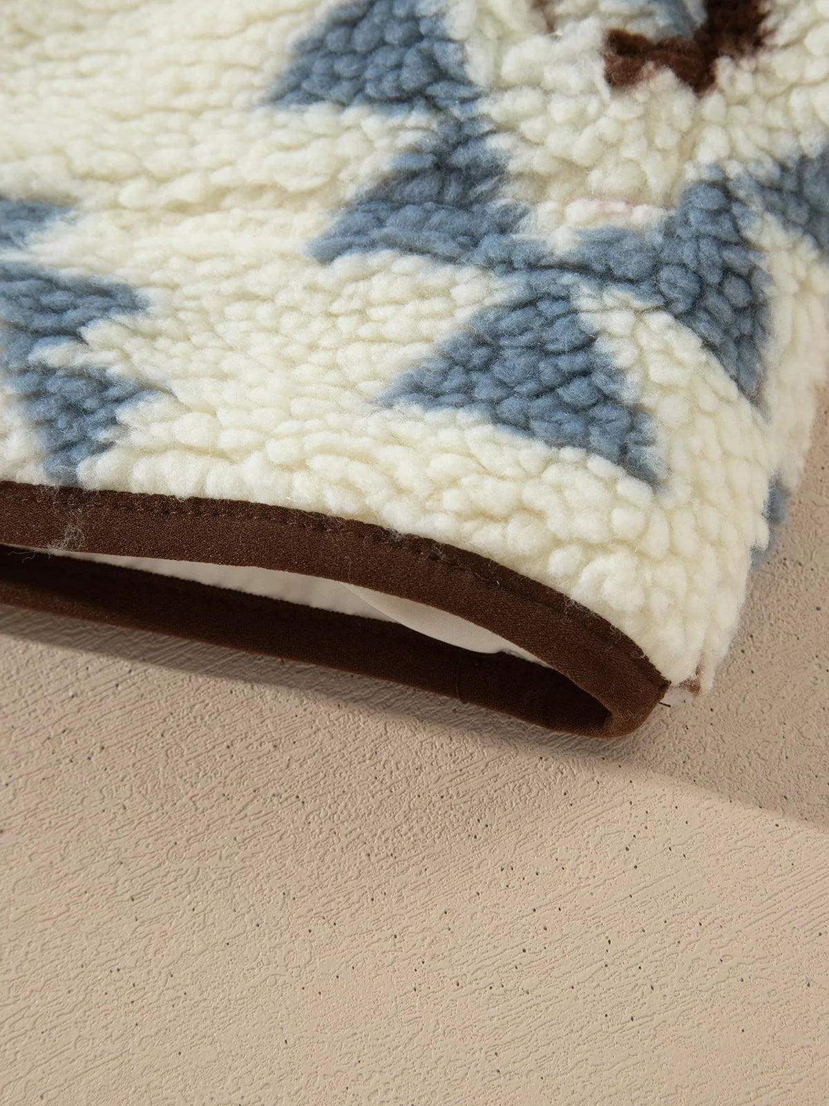 Cream blue and brown geometric print sherpa sweatshirt, cuff detail
