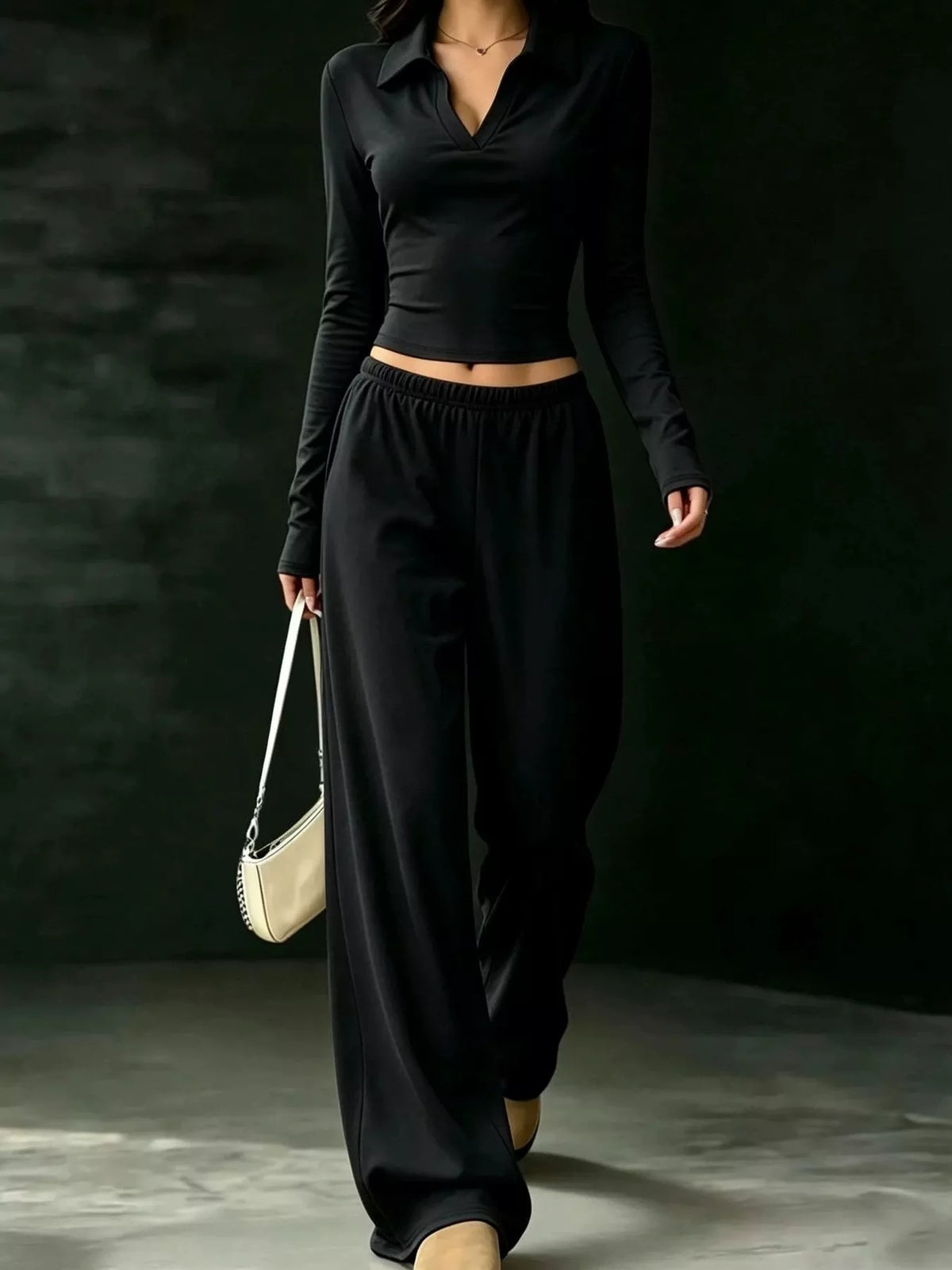 Black collared crop top and wide-leg pants set, front walking view