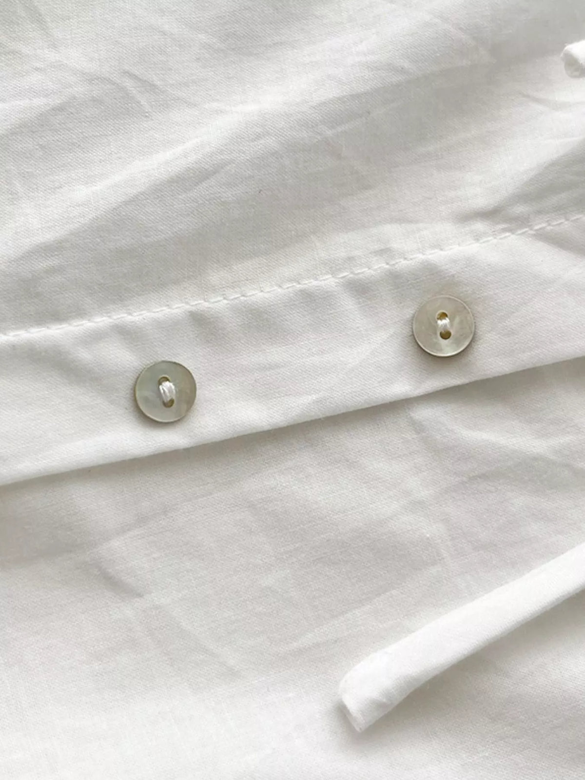 Women's Ruffled Square Neck Tiered Maxi Dress in white — button detail view