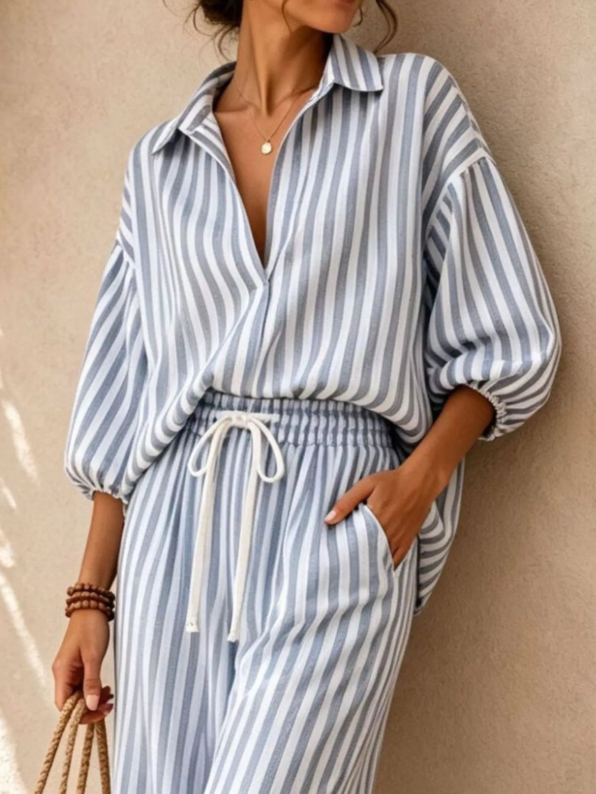 Blue and white striped shirt and drawstring pants set, shirt and waist detail
