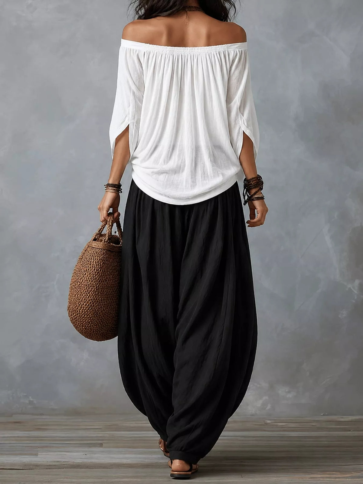 White top and black pants off-shoulder top and wide-leg harem pants set — back view