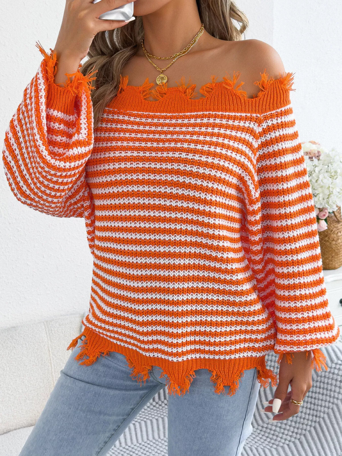 Orange off-shoulder frayed hem striped sweater