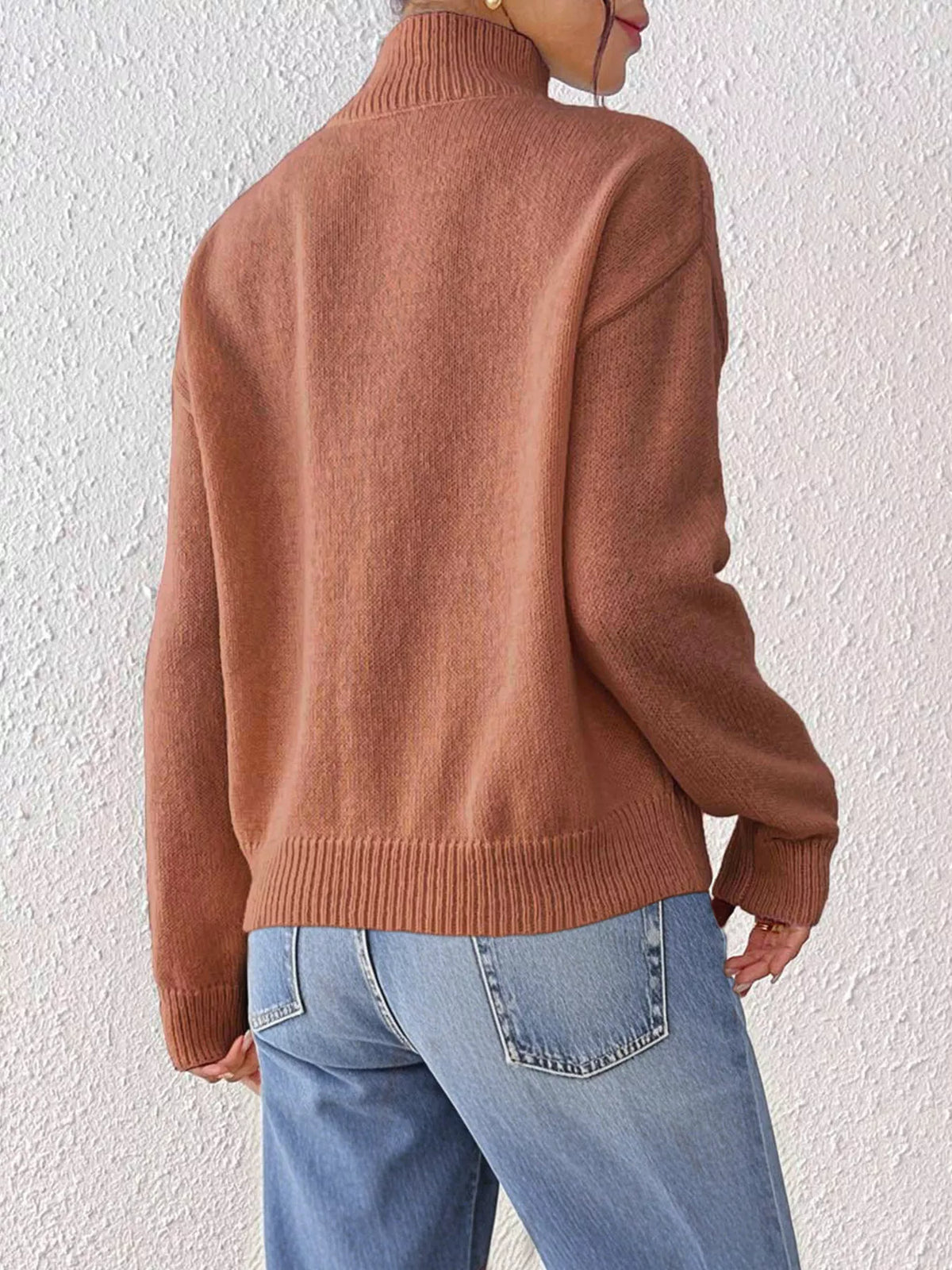 Rust floral applique mock-neck sweater, back view.