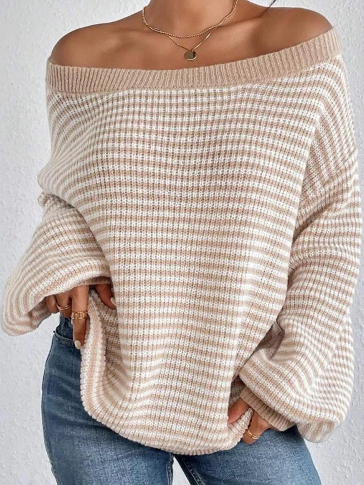 Beige and white striped knit boat neck sweater